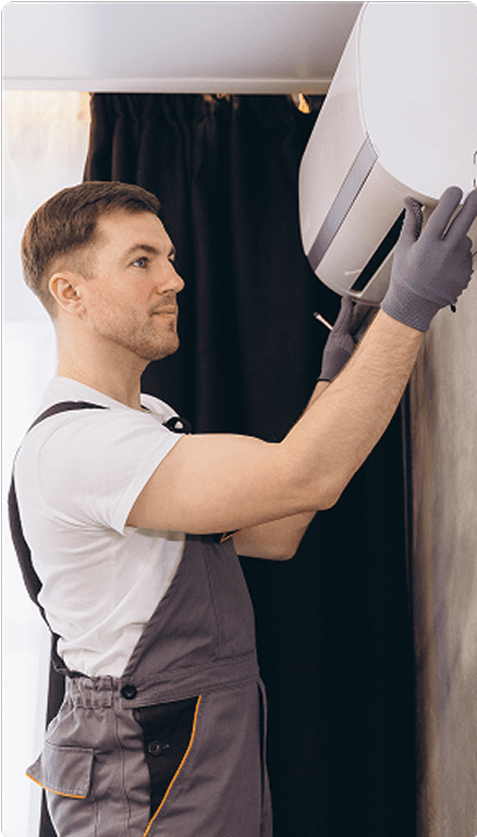 Technician installing an air conditioning unit.